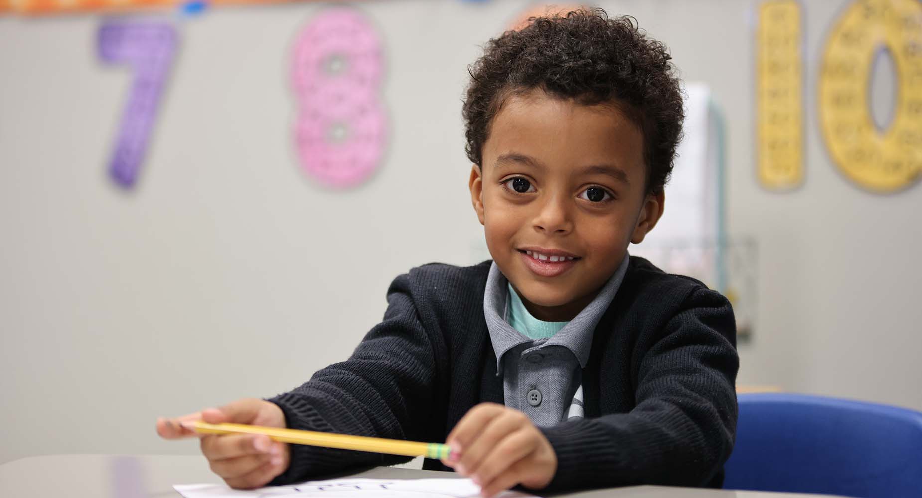 Teacher helping student