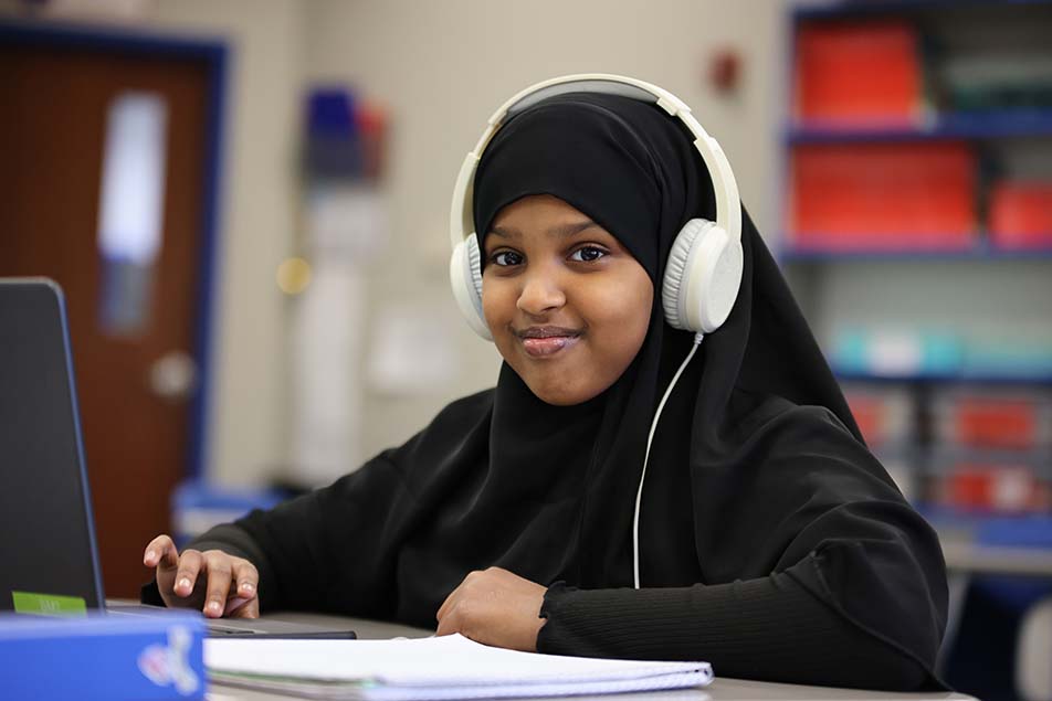 students and teacher working in classroom