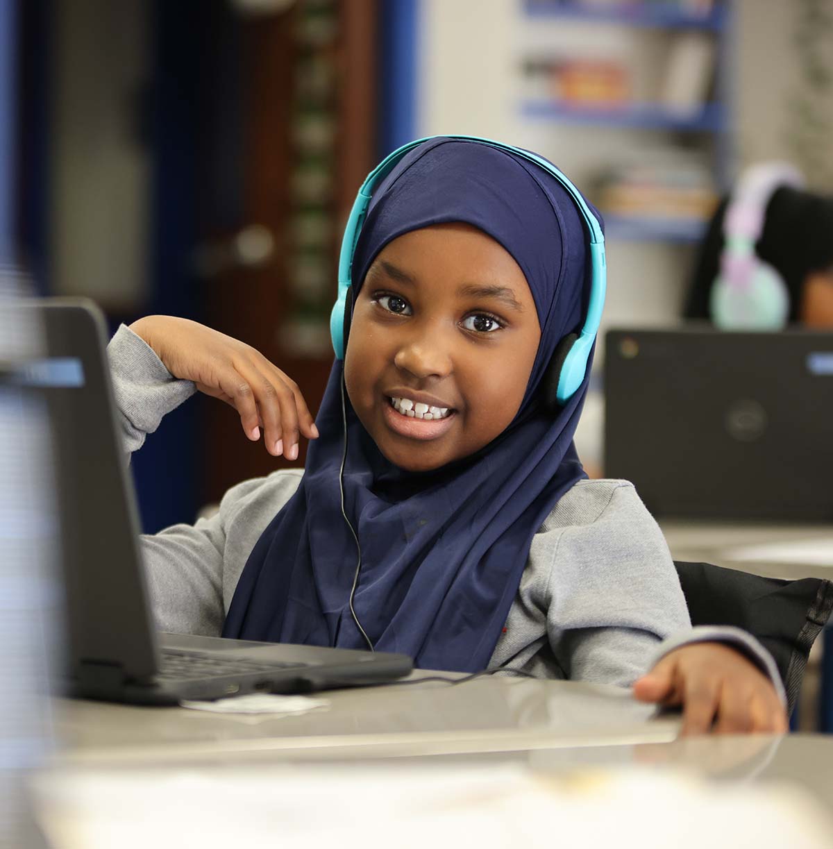 Student drawing in a classroom.