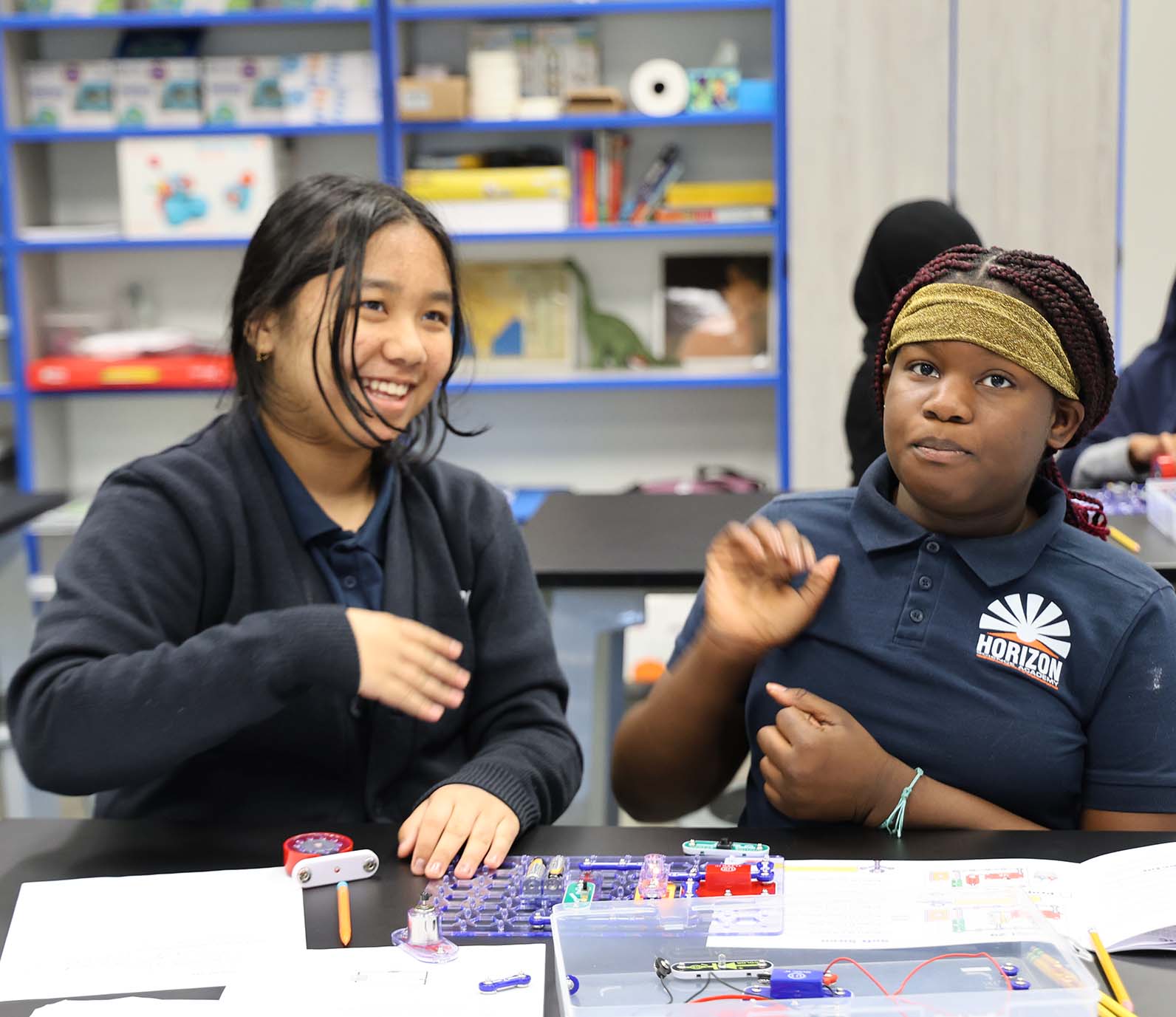 HSA Westerville student drawing at a desk in a classroom setting