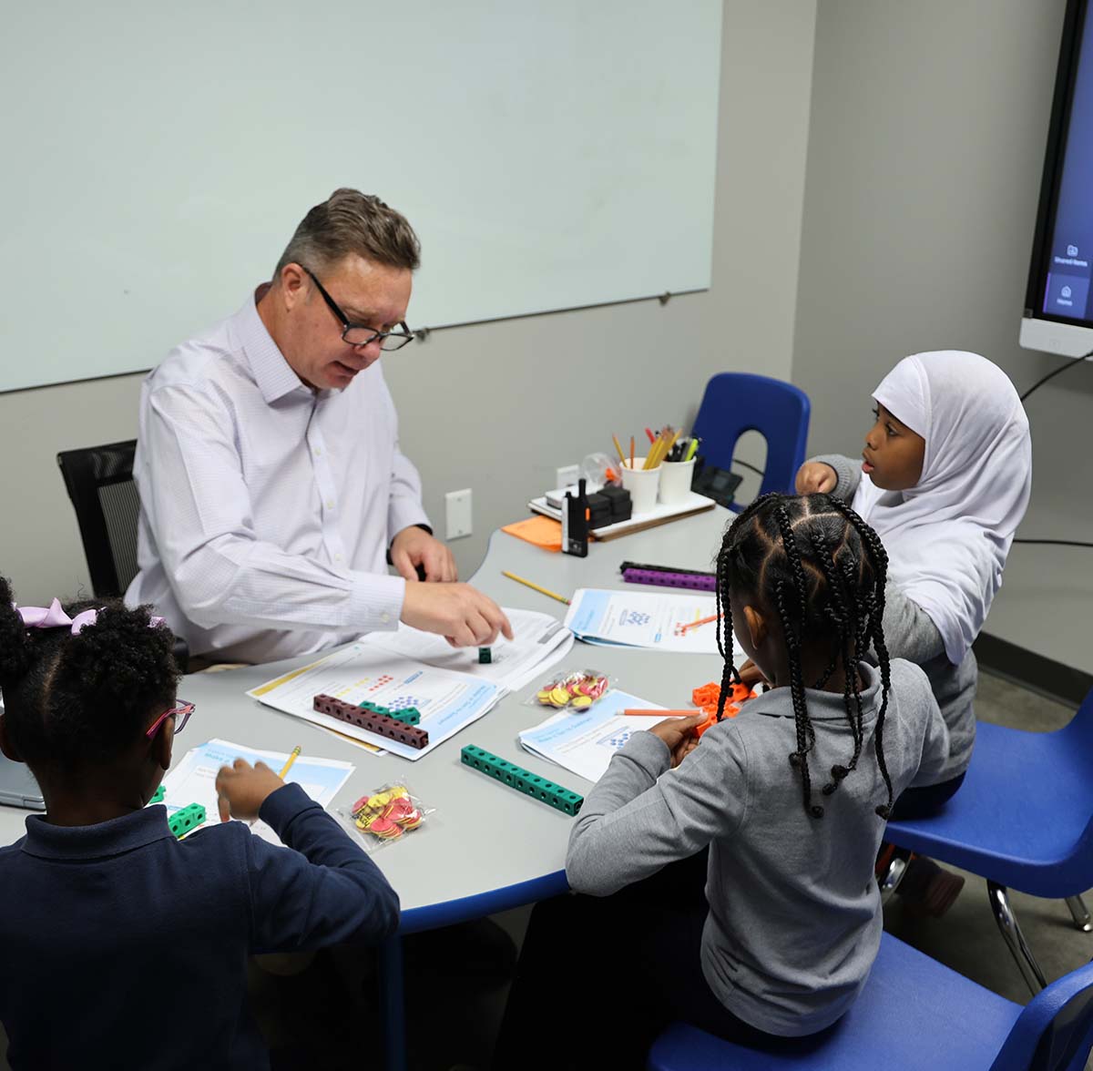 HSA Westerville Teacher and student interacting at a classroom desk